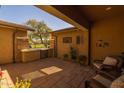 Private patio with comfortable seating and a view of the neighborhood at 5054 S Advant Ter, Mesa, AZ 85212