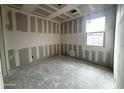 New bedroom with drywall and natural light from window providing a serene space at 5615 W Summerside Rd, Laveen, AZ 85339