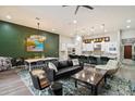 Inviting living room with stylish furnishings, open to the modern kitchen and adjacent dining area at 7340 E Conquistadores Dr, Scottsdale, AZ 85255