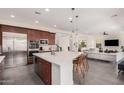 Spacious kitchen featuring a large center island, modern appliances, and seamless access to living area at 921 E Buist Ave, Phoenix, AZ 85042