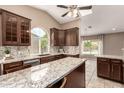 Spacious kitchen featuring granite countertops, stainless steel appliances, and vaulted ceilings at 926 W Grand Caymen Dr, Gilbert, AZ 85233