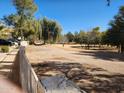 Expansive green space in the community with mature trees and landscaping creates a peaceful environment at 10080 E Mountainview Lake Dr # 110, Scottsdale, AZ 85258