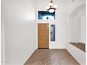 Bright foyer featuring high ceilings, tile floors, and neutral paint at 1079 S Western Skies Dr, Gilbert, AZ 85296