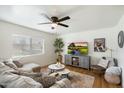 Comfortable living room showcasing light-colored walls, a ceiling fan, and natural light at 1504 W 6Th St, Mesa, AZ 85201
