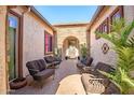 Charming courtyard with ample seating, perfect for outdoor gatherings and relaxation at 16445 S 176Th Ln, Goodyear, AZ 85338