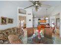Bright and airy living room featuring high ceilings, neutral walls, tile floors, and an open floor plan at 20218 N 61St Ave, Glendale, AZ 85308