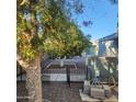 Landscaped backyard showcasing mature trees and a fenced-in area for privacy at 3160 E Main St # 72, Mesa, AZ 85213