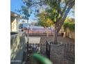 Private backyard featuring a mature tree, stone landscaping, and fenced-in area at 3160 E Main St # 72, Mesa, AZ 85213