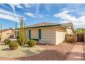 Single-story home featuring desert landscaping with gravel accents and desert plants at 4401 E Walatowa St, Phoenix, AZ 85044