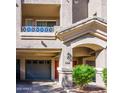 Charming townhouse with a private garage, covered entry, and desert-friendly landscaping at 4465 E Paradise Village S Pkwy # 1179, Phoenix, AZ 85032