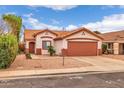 Lovely single-story home with desert landscaping, a front yard palm tree, and a two-car garage at 8139 E Osage Ave, Mesa, AZ 85212