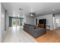 Spacious living room with neutral tones, tile flooring, and ample natural light at 8139 E Osage Ave, Mesa, AZ 85212