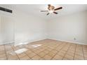 Neutral bedroom with tile flooring and ceiling fan at 9245 S 4Th Ave, Phoenix, AZ 85041