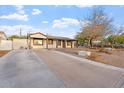 Spacious driveway leading to a charming single-story home at 9245 S 4Th Ave, Phoenix, AZ 85041