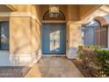 Welcoming entryway featuring a stylish blue double front door and elegant tile flooring at 10431 N 55Th Pl, Paradise Valley, AZ 85253