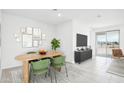 Bright dining area features stylish table with seating, perfect for enjoying meals with Gathering and friends at 15773 W Hackamore Dr, Surprise, AZ 85387