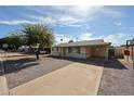 Lovely single-story home with covered front porch and extended driveway offering ample parking at 1757 W Argon St, Mesa, AZ 85201