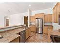 Bright kitchen with stainless steel appliances, and updated cabinets at 20329 E Bronco Dr, Queen Creek, AZ 85142