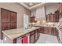 Gourmet kitchen featuring granite countertops, stainless steel appliances, and custom cabinetry at 30056 N 129Th Ave, Peoria, AZ 85383