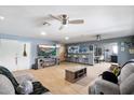 Spacious living room with an electric fireplace and a convenient bar area for entertaining at 3429 W Aire Libre Ave, Phoenix, AZ 85053