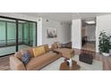 Relaxing living room featuring a comfortable couch, decor, and abundant natural light at 4808 N 24Th St # 925, Phoenix, AZ 85016