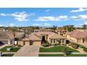 Well-maintained home with a three-car garage and lush green lawn at 4862 S Jojoba Way, Chandler, AZ 85248