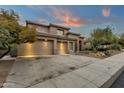 Charming home featuring a three-car garage and low-maintenance desert landscaping at 11036 E Evans Rd, Scottsdale, AZ 85255