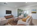 Bright, open living room featuring modern furniture and an inviting flow to the adjacent kitchen area at 1238 N 78Th St, Scottsdale, AZ 85257