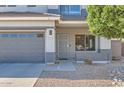 Inviting front porch with security door, leading to a well-maintained home with a two-car garage at 14532 N 146Th Ln, Surprise, AZ 85379