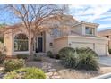 Charming two-story home featuring a three-car garage, desert landscaping, and a tile roof at 1901 W Mulberry Dr, Chandler, AZ 85286