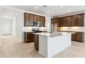 Open kitchen featuring an island, stainless steel appliances, and modern cabinets at 25606 N 154Th Ln, Surprise, AZ 85387