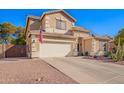 Charming two-story home with a two-car garage and low-maintenance desert landscaping at 32795 N Hidden Canyon Dr, San Tan Valley, AZ 85144