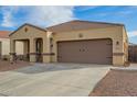 Charming exterior of a one-story home with a covered porch and a two car garage at 4845 E Iolite St, San Tan Valley, AZ 85143