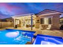 Backyard featuring a sparkling pool, covered patio with outdoor seating, perfect for entertaining at 20552 E Reins Rd, Queen Creek, AZ 85142