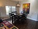 Dining room featuring a dining table with seating for six and natural light at 22803 S 215 St, Queen Creek, AZ 85142
