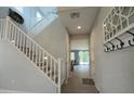 Inviting entryway with a staircase and coat rack creates a warm and organized welcome at 3841 E Oxford Ln, Gilbert, AZ 85295