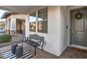 Cozy front porch features a bench and decor, creating a welcoming and relaxing outdoor space at 3841 E Oxford Ln, Gilbert, AZ 85295