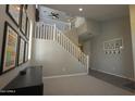 Spacious staircase leading to the second floor, with large windows for natural light at 3841 E Oxford Ln, Gilbert, AZ 85295