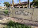 A welcoming entrance sign to Casa Los Cerros with lush landscaping at 4901 S Calle Los Cerros Dr # 206, Tempe, AZ 85282