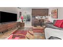 Open-concept living room featuring tile floors, modern furnishings and stylish decor at 6240 N 16Th St # 37, Phoenix, AZ 85016