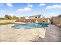 Beautiful backyard pool with travertine decking, mature landscaping, and perimeter block wall at 8615 S 45Th Gln, Laveen, AZ 85339