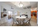 Bright dining area with stylish seating flows seamlessly into the living room and adjacent kitchen at 9450 N 94Th Pl # 215, Scottsdale, AZ 85258