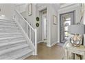 Elegant foyer with hardwood floors, staircase, and decorative accents at 10134 W Cashman Dr, Peoria, AZ 85383