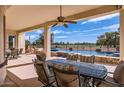 Inviting outdoor patio with ample seating, offering views of the pool, golf course, and a serene landscape at 13117 W Micheltorena Dr, Sun City West, AZ 85375