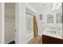 Bathroom featuring a double sink vanity and a shower-tub combination at 1920 E Bell Rd # 1153, Phoenix, AZ 85022