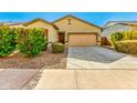 Inviting single-story home with well-maintained landscaping and a cozy facade at 2379 E San Miguel Dr, Casa Grande, AZ 85194