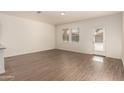 Bright and airy living room with laminate floors and plenty of natural light at 2379 E San Miguel Dr, Casa Grande, AZ 85194