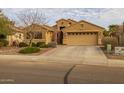 Charming home with desert landscaping, an American flag, and a two-car garage at 3896 E Aragonite Ln, San Tan Valley, AZ 85143