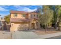 Two-story home with a well-maintained lawn, three-car garage, and attractive curb appeal at 43524 W Bailey Dr, Maricopa, AZ 85138