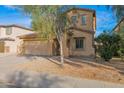 Charming two-story home with a two-car garage and low maintenance desert landscaping at 43524 W Bailey Dr, Maricopa, AZ 85138